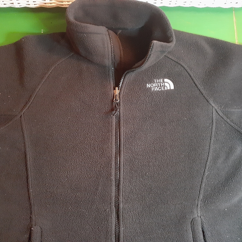 black zip north face jacket